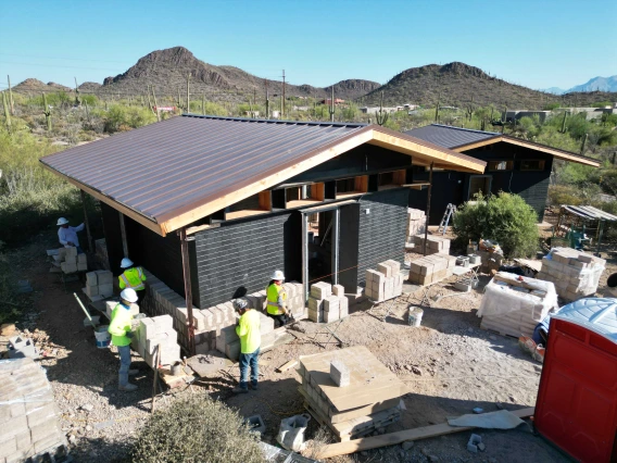 Photo of a cabin undergoing renovation with hempcrete used for the walls. 
