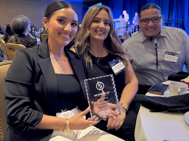 Kaya Orona poses with her 40 Under 40 Award