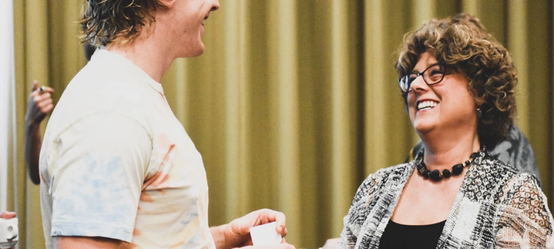Esther Sternberg speaks with a conference attendant after her lecture, Creating Spaces for Healthy Aging